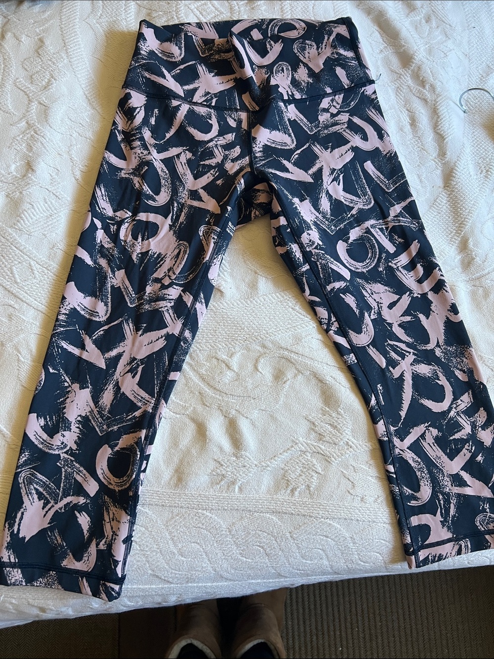 lululemon athletica Black Leggings with Light Pink Brushstroke Print says “Love